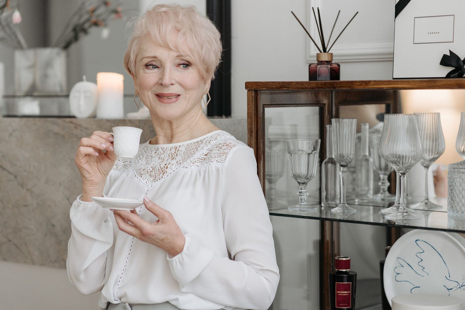 A woman in her sixties at home, calm and considering
